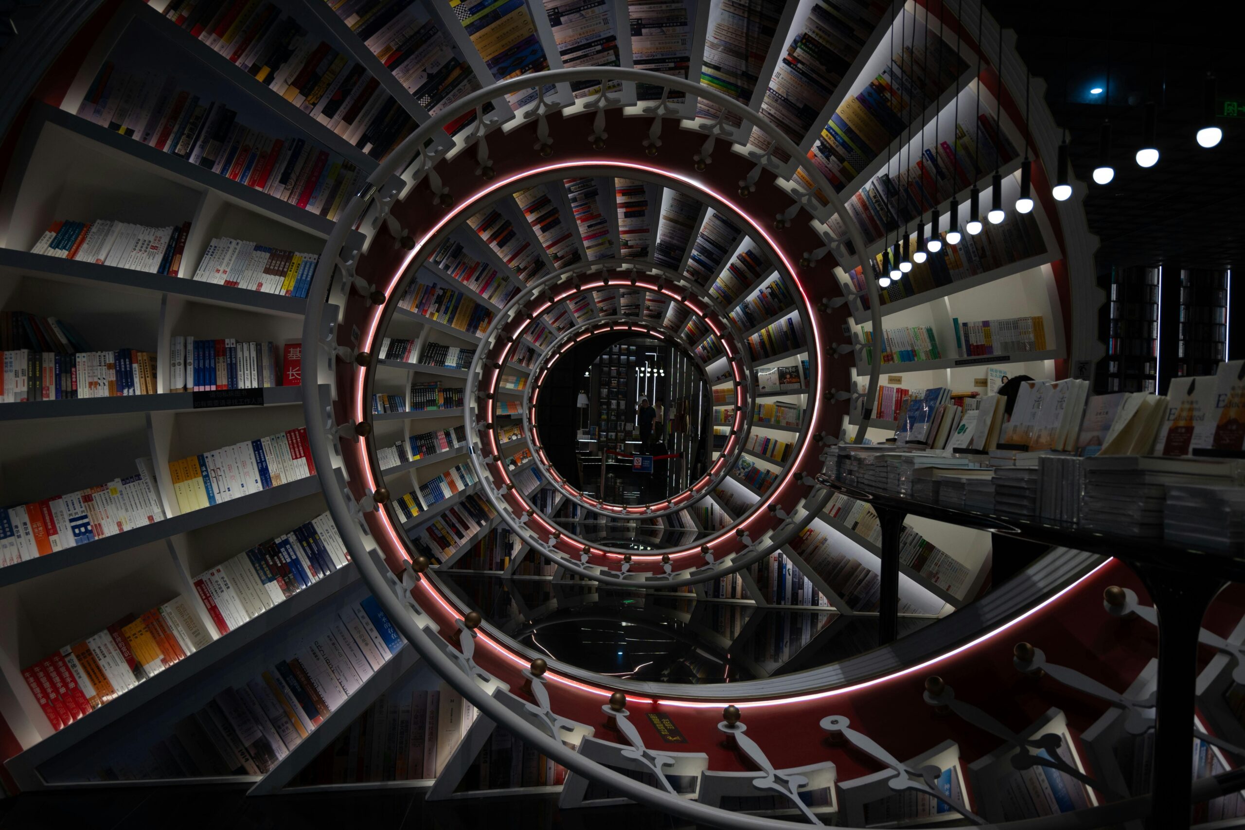 Explore a mesmerizing spiral bookshelf design in a modern Shenzhen bookstore, capturing innovative architecture.